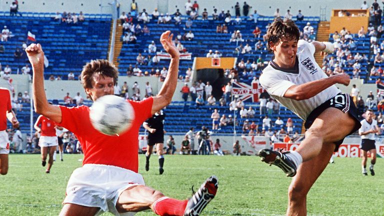 English forward Gary Lineker R kicks the ball past Polish defender Stefan Majewski during the World Cup first round soccer match between England and Poland 11 June 1986 in Monterrey. Lineker scored three goals as England defeated Poland 3-0.