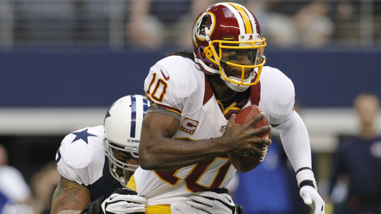 Dallas Cowboys wide receiver Dez Bryant (88) eludes Washington Redskins  defenders to take a Tony Romo pass for 85 yards and a touchdown in the  third quarter at Cowboys Stadium in Arlington