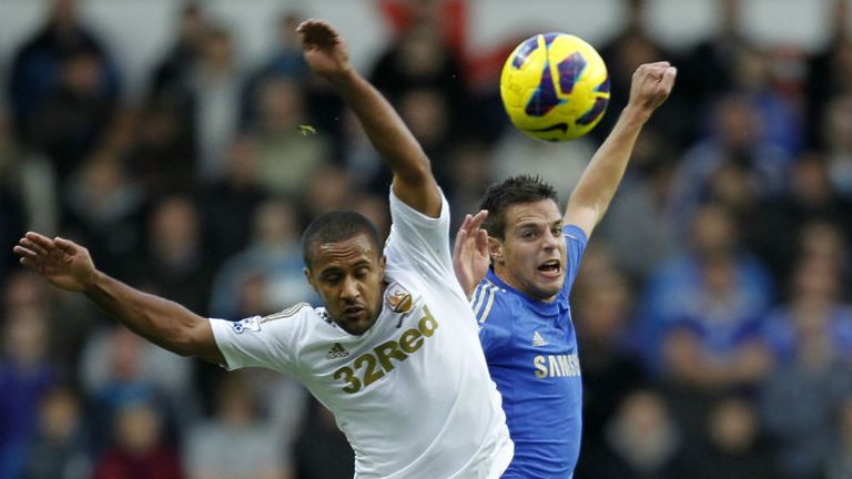 Chelseas Cesar Azpilicueta vies with Swansea Citys Wayne Routledge 