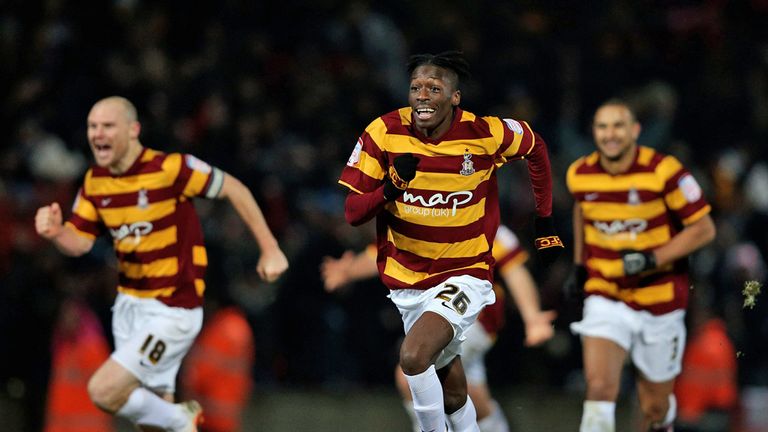Bradford players celebrate after Goalkeeper Matt Duke of Bradford saves a penalty during the shootout to win the Capital One Cup quarter final match between Bradford City and Arsenal at the Coral Windows Stadium, Valley Parade on December 11, 2012 in Bradford, England. 