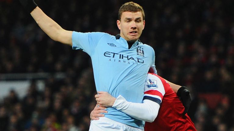 Edin Dzeko is fouled in the box by Laurent Koscielny, who gets sent off and City are awarded a penalty