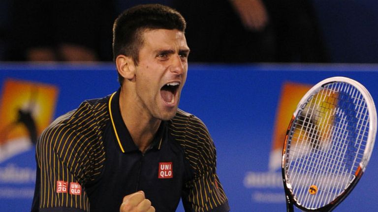 Novak Djokovic celebrates winning his third successive Australian Open mens title, the first player to do so in the Open era