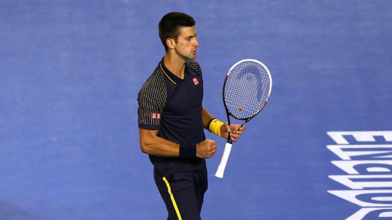 Novak Djokovic celebrates winning the third set of the Australian Open mens final