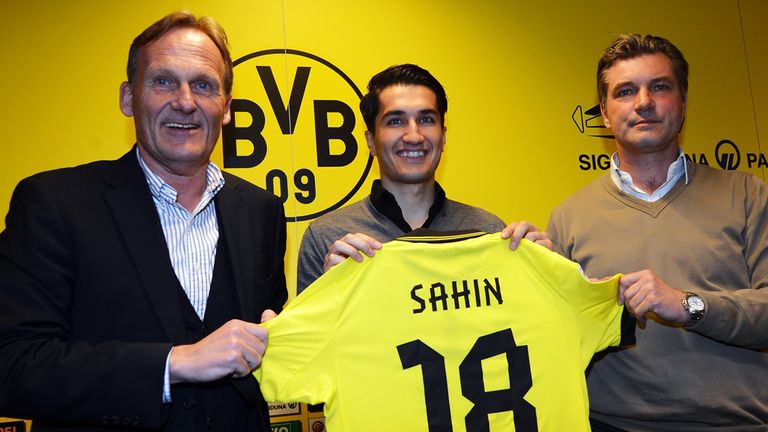 New player Nuri Sahin poses with chairman Hans Joachim Watzke and manager Michael Zorc during a Borussia Dortmund press conference at Signal Iduna Park on January 11, 2013 in Dortmund, Germany.