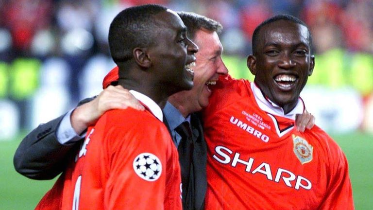 Sir Alex Ferguson celebrates with Andy Cole and Dwight Yorke