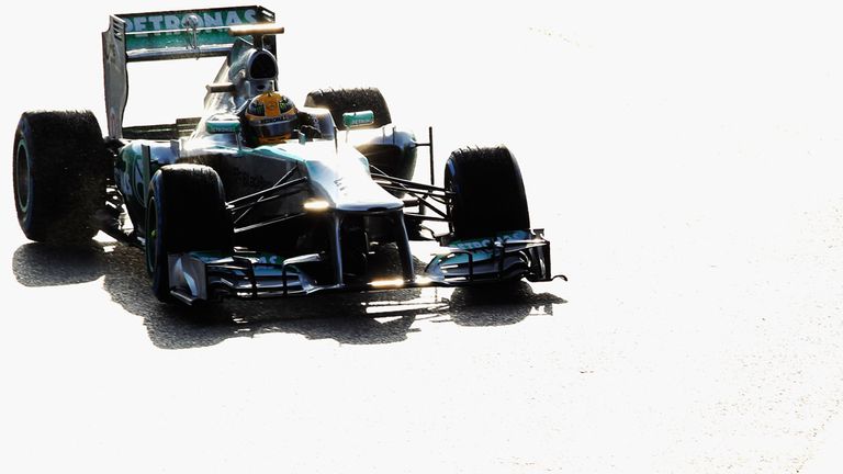 Hamilton takes an early-morning drive in the rain