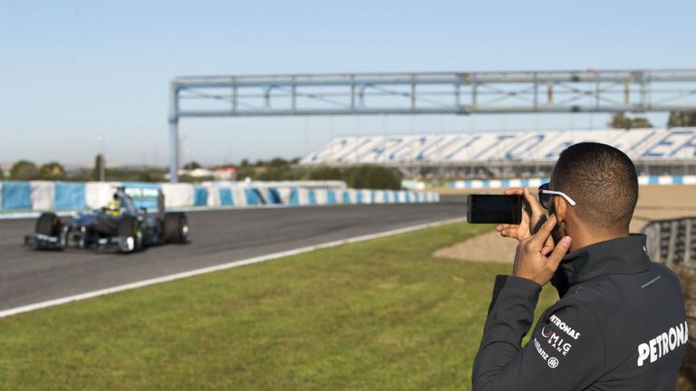 Lewis Hamilton takes a snap of his new office