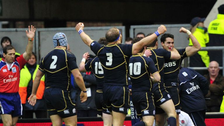 Scotland players celebrate after Sean Maitland scores a try