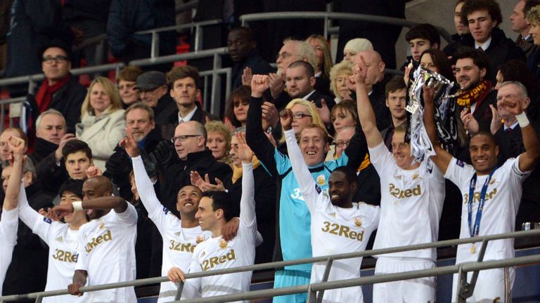 Swansea City celebrate winning the Capital One Cup after beating Bradford at Wembley