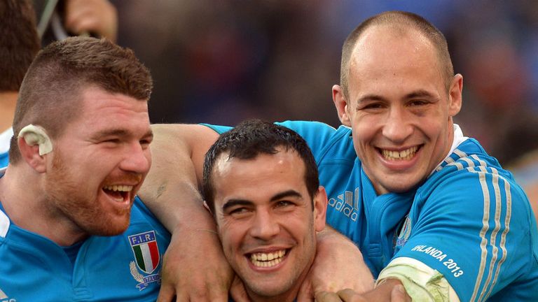 Michele Rizzo, Gonzalo Canale and captain Sergio Parisse celebrate the historic win over Ireland