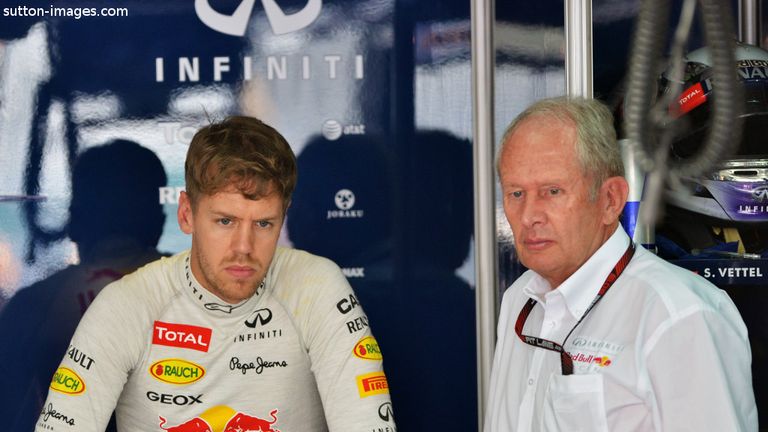 Marko alongside Sebastian Vettel in the Red Bull garage