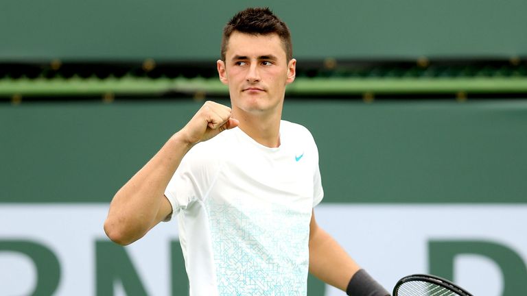 Bernard Tomic celebrates breaking Thomaz Bellucci  in the second set during the BNP Paribas Open at the Indian Wells Tennis Garden