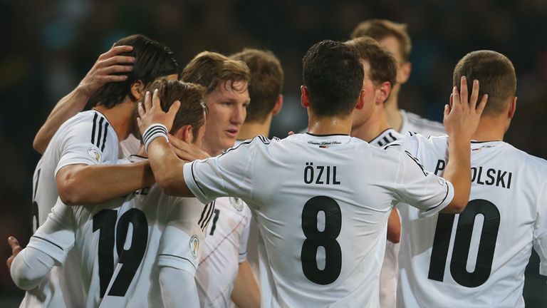 Bastian Schweinsteiger of Germany celebrates scoring the opening goal with his team mates during World Cup qualifier group C match against Kazakhstan 