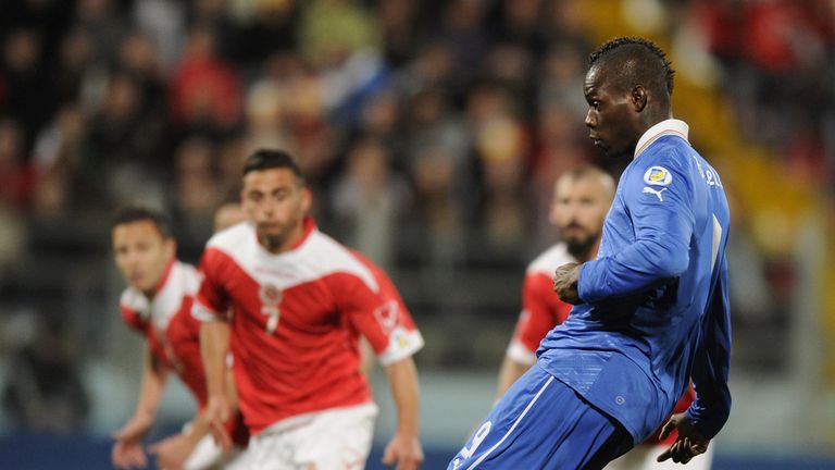 Mario Balotelli of Italy scores the opening goal with a penalty-kick against Malta.