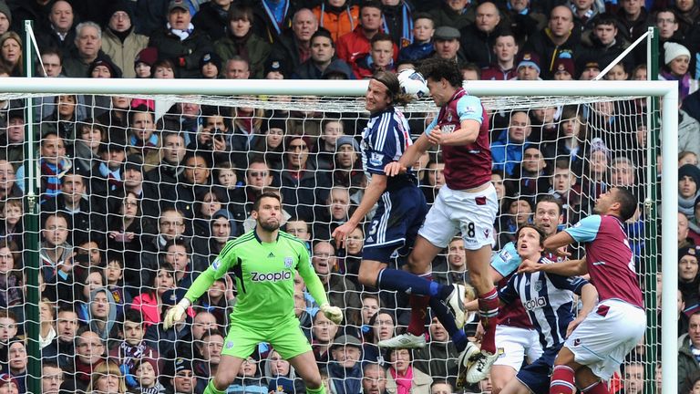 Andy Carroll scores the first of his two goals against West Brom