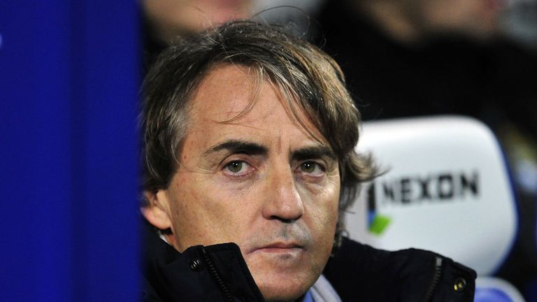 Roberto Mancini looks on before the Premier League match at Queens Park Rangers