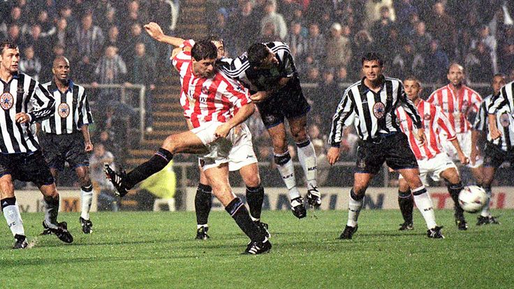 Sunderland's Niall Quinn swoops to score for Sunderland with against Newcastle United in 1999.