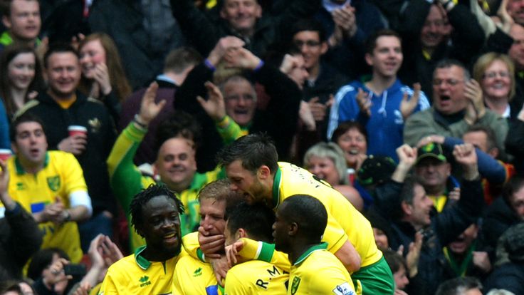 Norwich's Michael Turner celebrates scoring during the Barclays Premier League match at the Emirates Stadium, London.