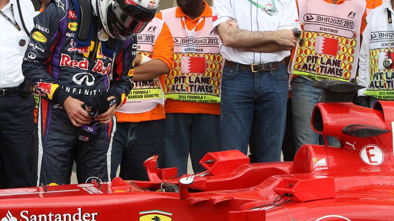 Sebastian Vettel takes a crafty look at the Ferrari