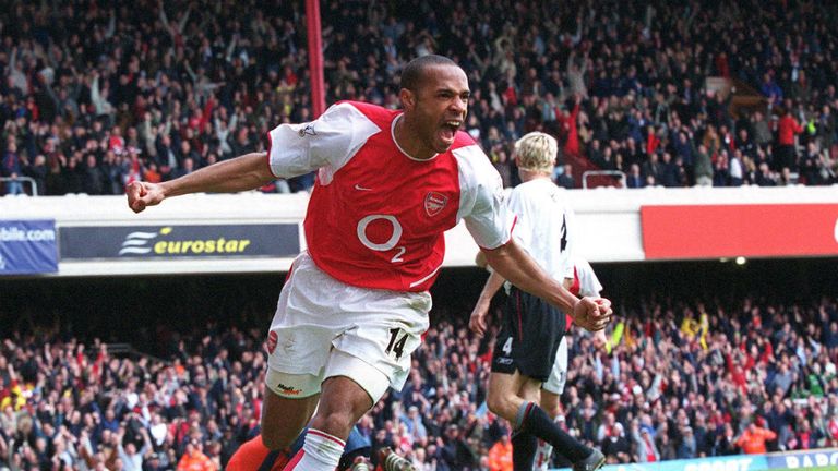 Thierry Henry of Arsenal celebrates scoring his 2nd goal against Liverpool at Highbury Stadium on May 15 2004