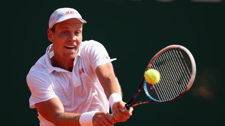 Tomas Berdych of Czech Republic plays a backhand against Fabio Fognini of Italy in their third round match during day five of the ATP Monte Carlo Masters