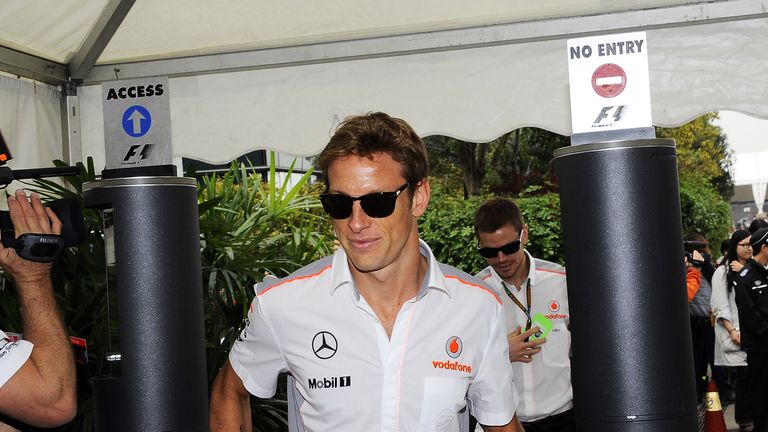 Jenson Button arrives at the track