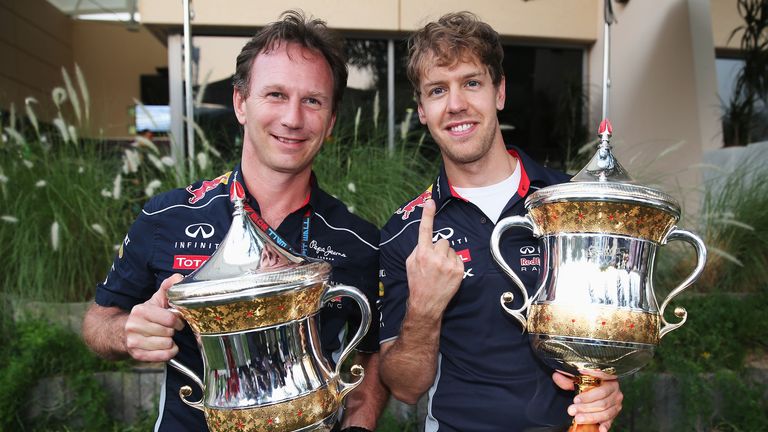 Sebastian Vettel and Christian Horner show off their trophies