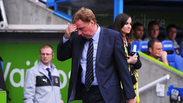 Harry Redknapp, manager of Queens Park Rangers wipes his brow prior to the Premier League match against Reading at the Madejski Stadium.