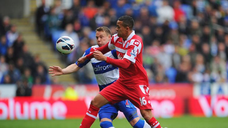 Jermaine Jenas of Queens Park Rangers is closed down by Chris Gunter of Reading during the Premier League match at the Madejski Stadium.