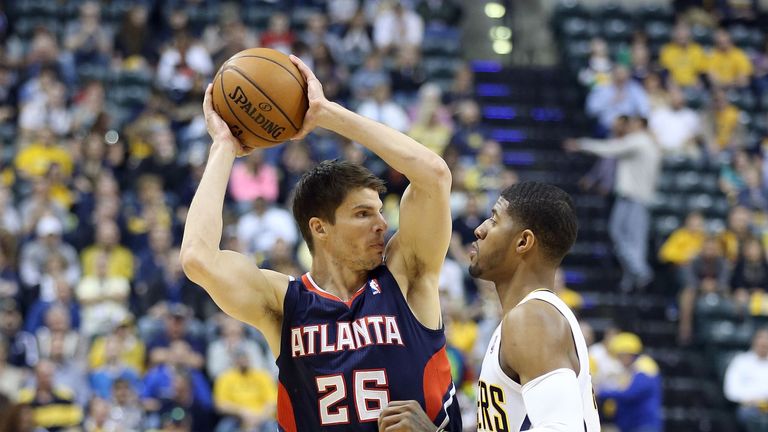 Kyle Korver of the Atlanta Hawks is defended by Paul George of the Indiana Pacers during game one