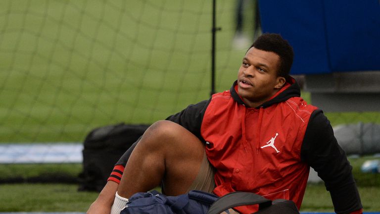 GB Olympic discus thrower Lawrence Okoye pictured in NFL drills at the London Soccerdome.