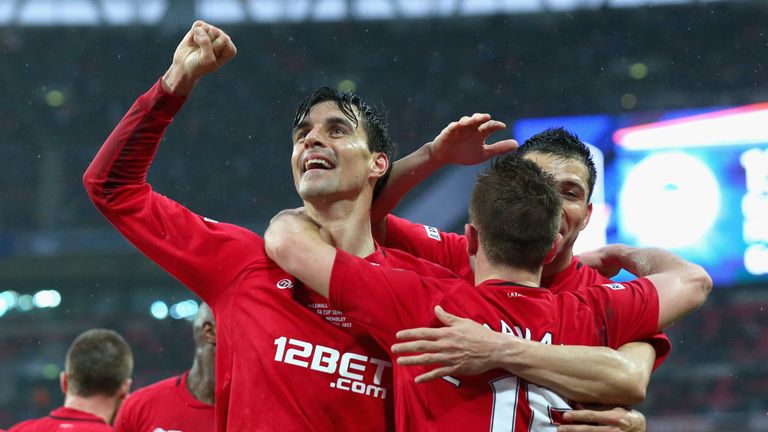 Paul Scharner of Wigan Athletic celebrates with goalscorer team mate Callum McManaman after he scores his team's second goal during the FA Cup with Budweiser Semi Final match between Millwall and Wigan Athletic at Wembley Stadium