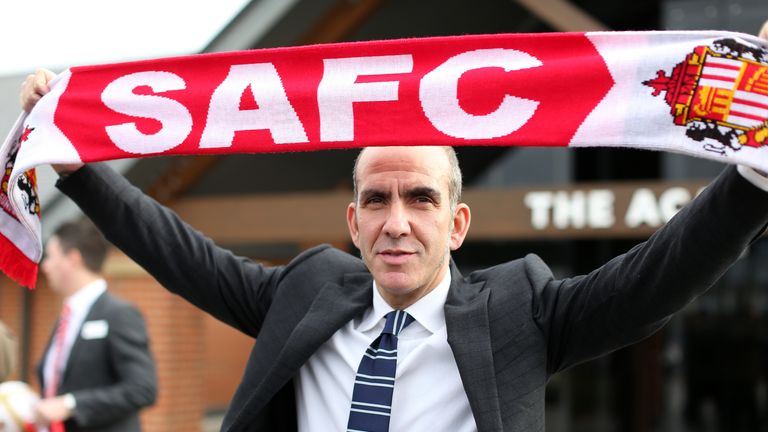 Paolo Di Canio poses with a club scarf after being unveiled as the new Sunderland manager at The Academy of Light training ground.