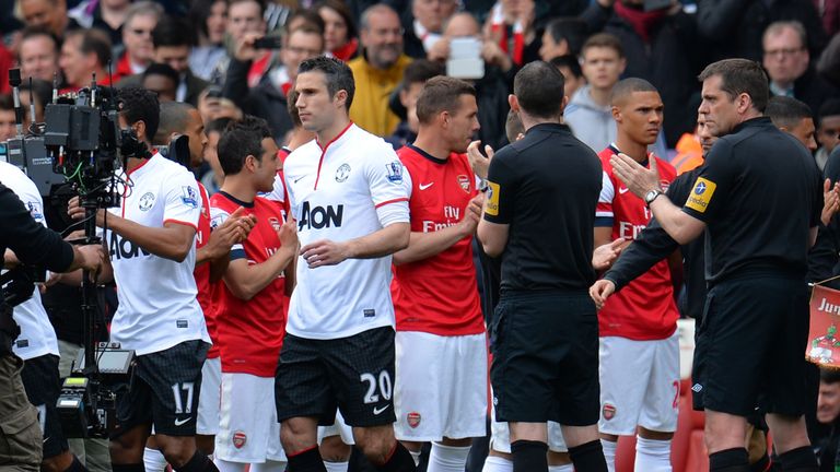 Manchester United are given a guard of honour by the Arsenal before the Premier League match at Emirates Stadium