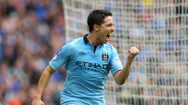 Samir Nasri celebrates as he scores the opening goal in the FA Cup semi-final against Chelsea.