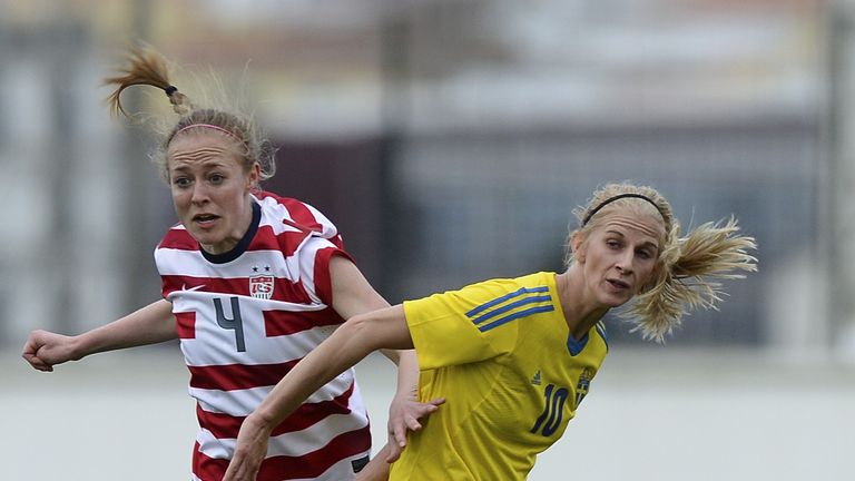 USA defender Rebecca Sauerbrunn (L) vies with Sweden's forward Sofia Jakobsson.