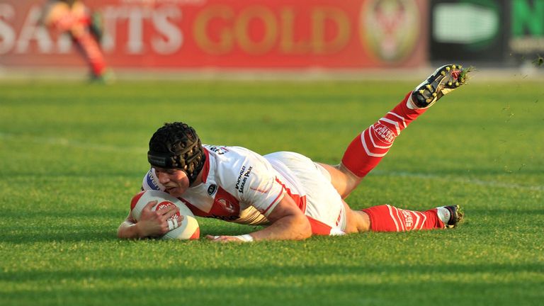 St Helens Jonny Lomax scores his second try against Leeds Rhinos during the Stobart Super League match at Langtree Park, St Helens.