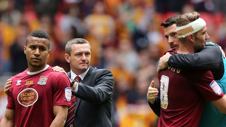 Aidy Boothroyd: Consoles his players after Northampton's defeat