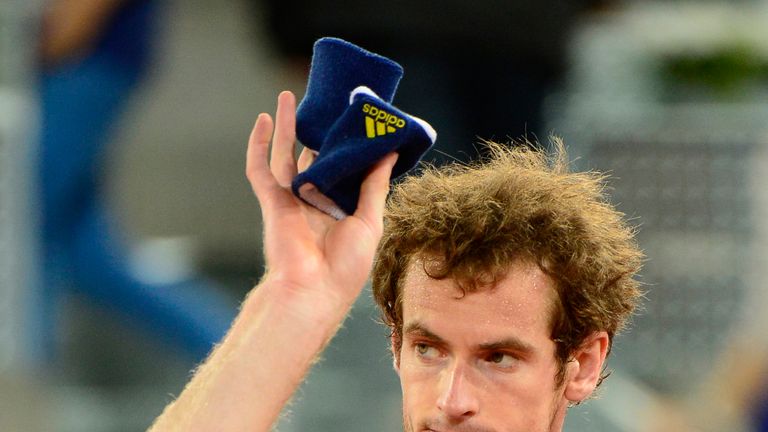 British player Andy Murray waves after being defeated at the end of his tennis match against Czech player Tomas Berdych at the Madrid Masters