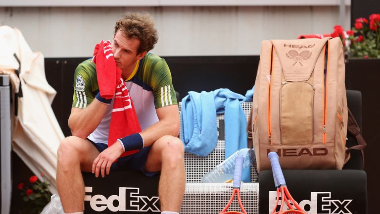 Andy Murray of Great Britain shows his dejection prior to taking an injury time out against Marcel Granollers of Spain in their second round match at the Rome Masters