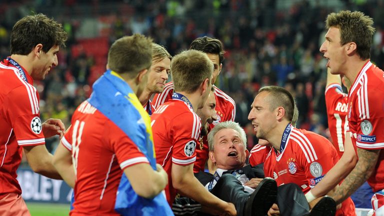 Bayern Munich's German Head Coach Jupp Heynckes is lifted up by his players after their victory in the UEFA Champions League final football match between Borussia Dortmund and Bayern Munich at Wembley Stadium in London on May 25, 2013, Bayern Munich won the game 2-1   AFP PHOTO / ANDREW YATES        (Photo credit should read ANDREW YATES/AFP/Getty Images)