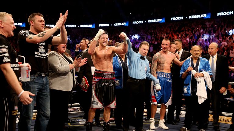 Carl Froch celebrates his points victory over Mikkel Kessler after their Super-Middleweight unification bout at the O2 Arena in London