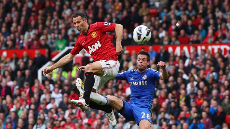 Ryan Giggs of Manchester United is tackled by Cesar Azpilicueta of Chelsea 