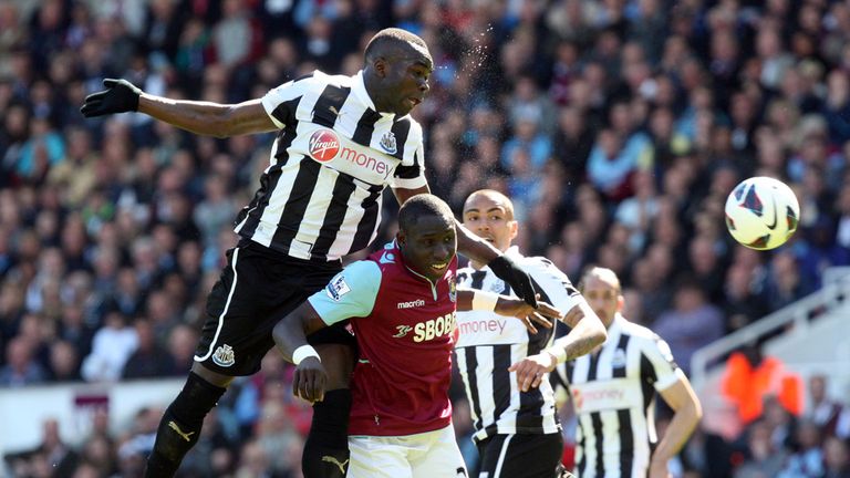 Cheik Tiote of Newcastle United rises above Mohamed Diame of West Ham