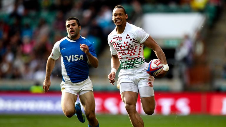 Dan Norton of England breaks away to score a try during the Marriott London Sevens