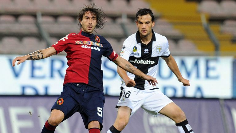 Daniele Conti of Cagliari and Marco Parolo of Parma in action 