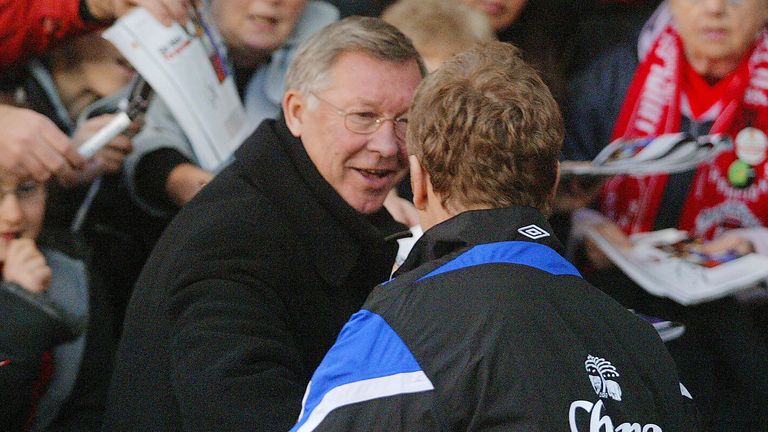 Sir Alex Ferguson welcomes Everton manager David Moyes before their Premier League match at Old Trafford. (2005)