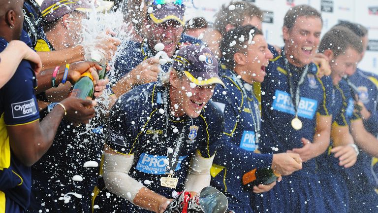 LONDON, ENGLAND - SEPTEMBER 15:  Captain Jimmy Adams of Hampshire is drenched in champagne as he holds the winner's trophy at the end of the Clydesdale Bank Pro40 Final between Hampshire and Warwickshire at Lord's Cricket Ground on September 15, 2012 in London, England.  (Photo by Mike Hewitt/Getty Images)