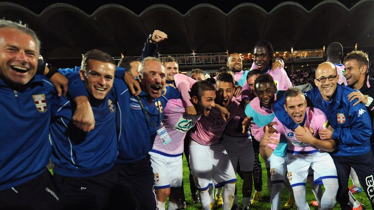 Evian's players and staff members celebrate 