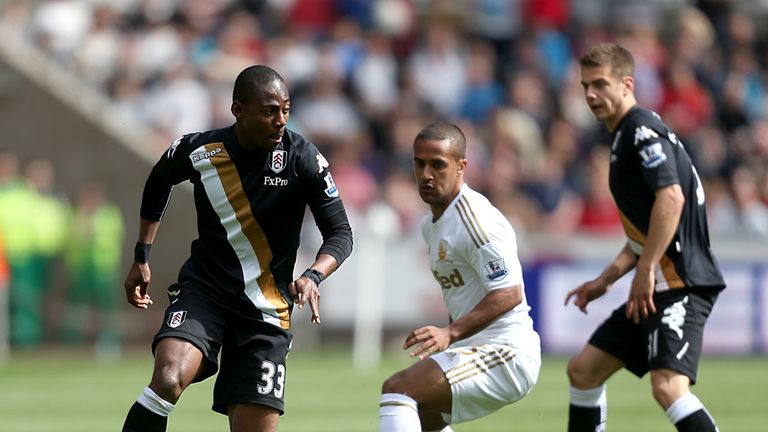 Fulham's Eyong Enoh and Swansea City's Wayne Routledge 